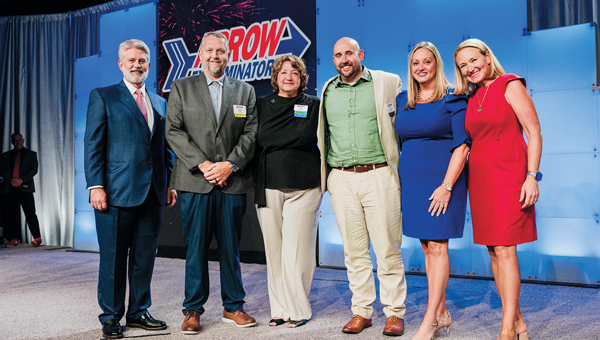 The dream team: The Fiscal Year Leadership Summit brought together company executives, managers and corporate support teams to recognize outstanding achievements. Pictured from left are President and COO Tim Pollard, Service Center Manager Chris Sprinkle, VP of Benefits Hali Smith, Service Center Manager Joe Conway, Chief Administrative Officer Shay Runion and CEO Emily Thomas Kendrick. (PHOTO: KELLI PRICE PHOTOGRAPH)